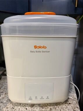White and Orange Baby Bottle Sterilizer